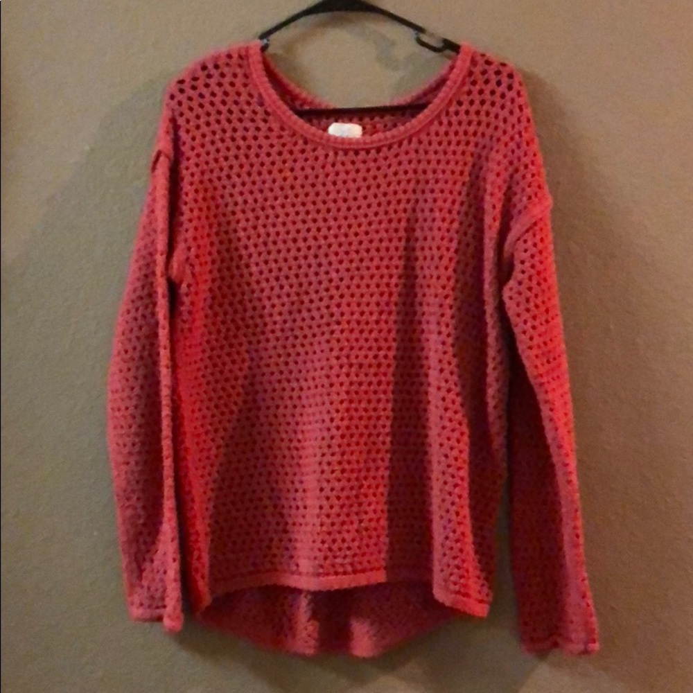 Salmon sweater with small holes